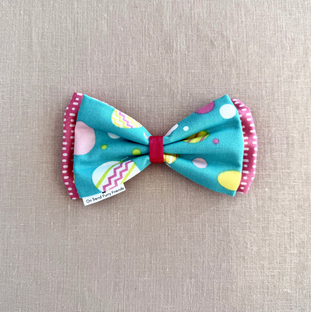 Bright Easter Eggs on Aqua Background in Scarves and Bows